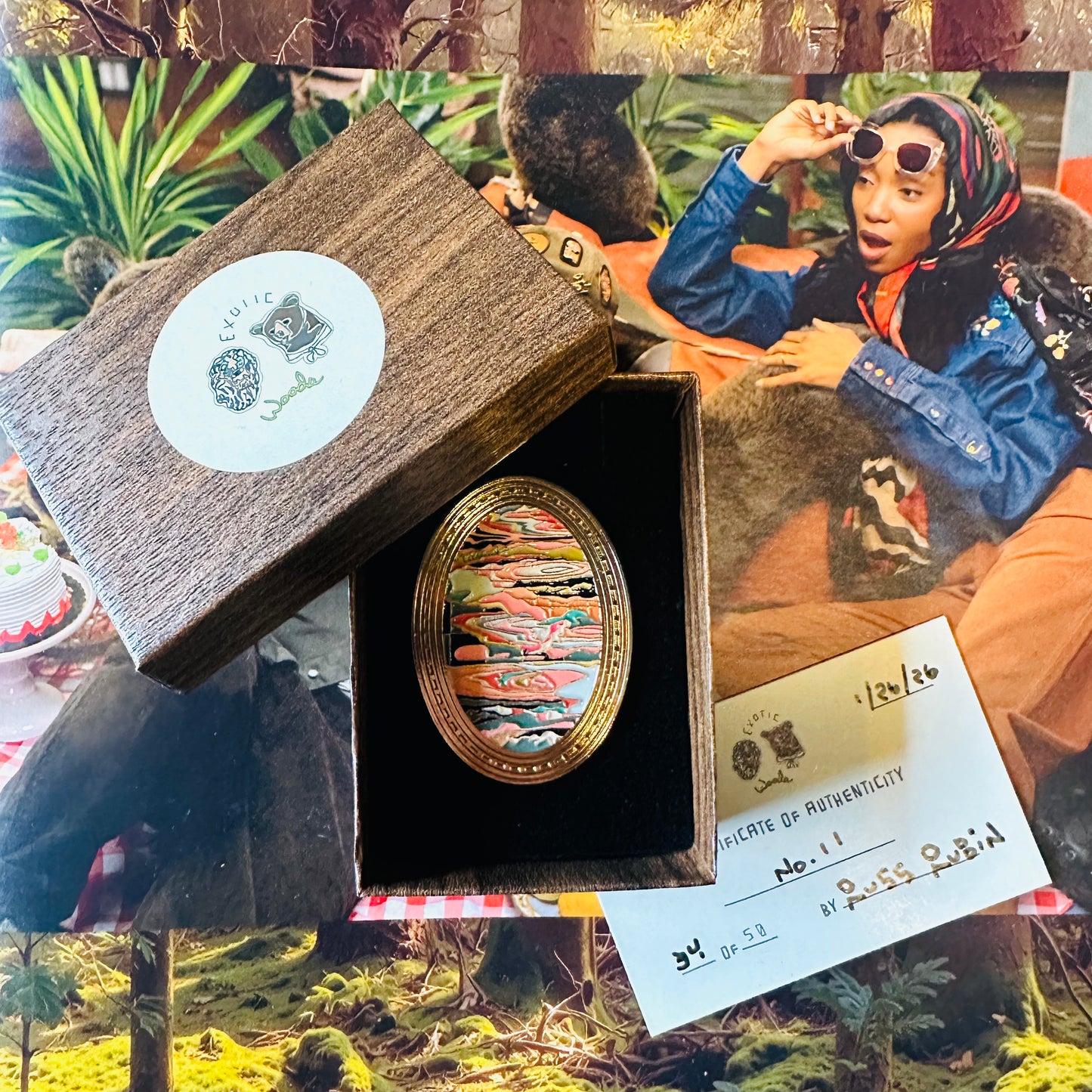 brooch on black velvet in wood look box with bear + lion sticker and certificate of authenticity