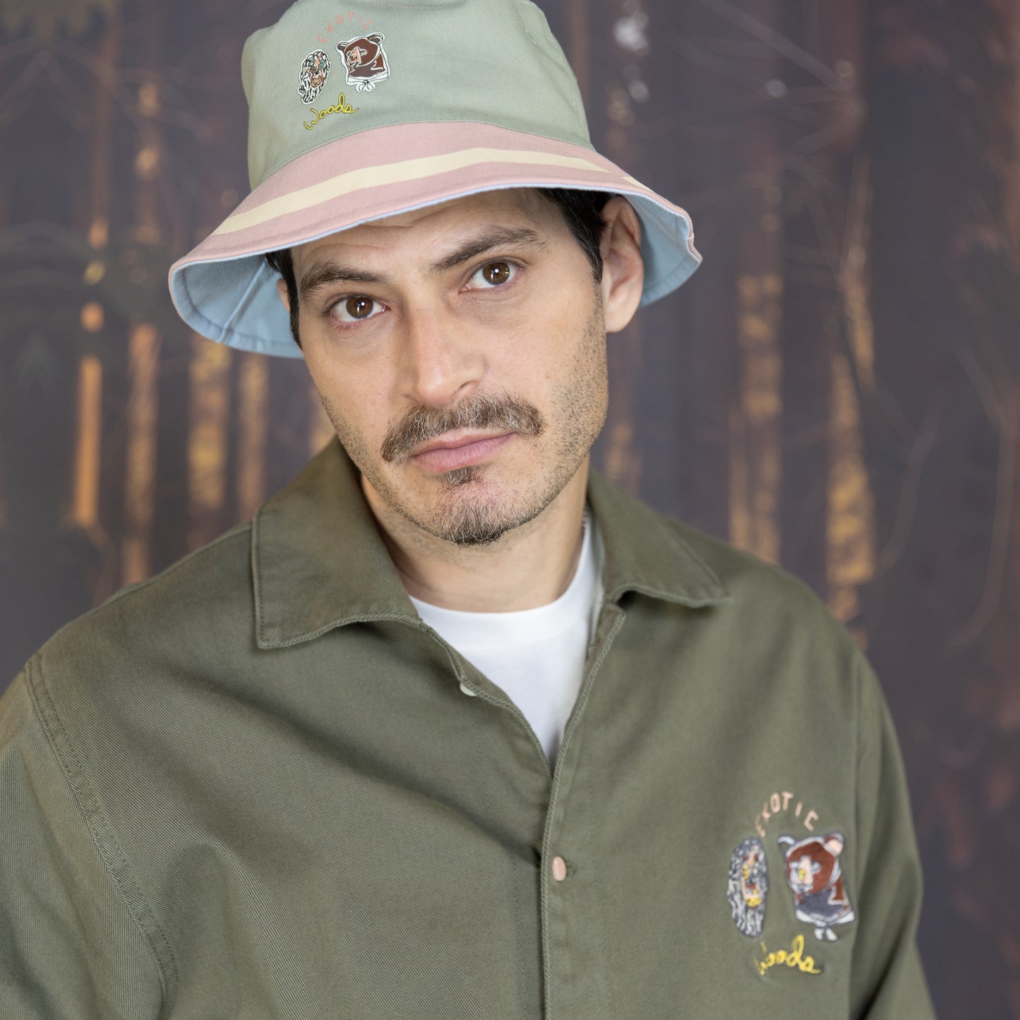 Be Out Bucket Hat front view on pink and green side on model