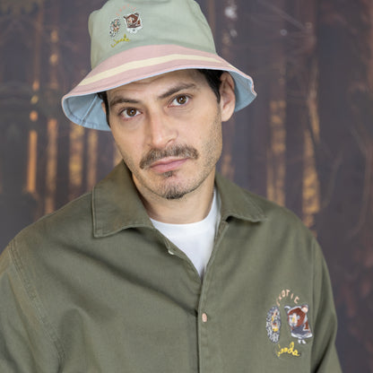 Be Out Bucket Hat front view on pink and green side on model