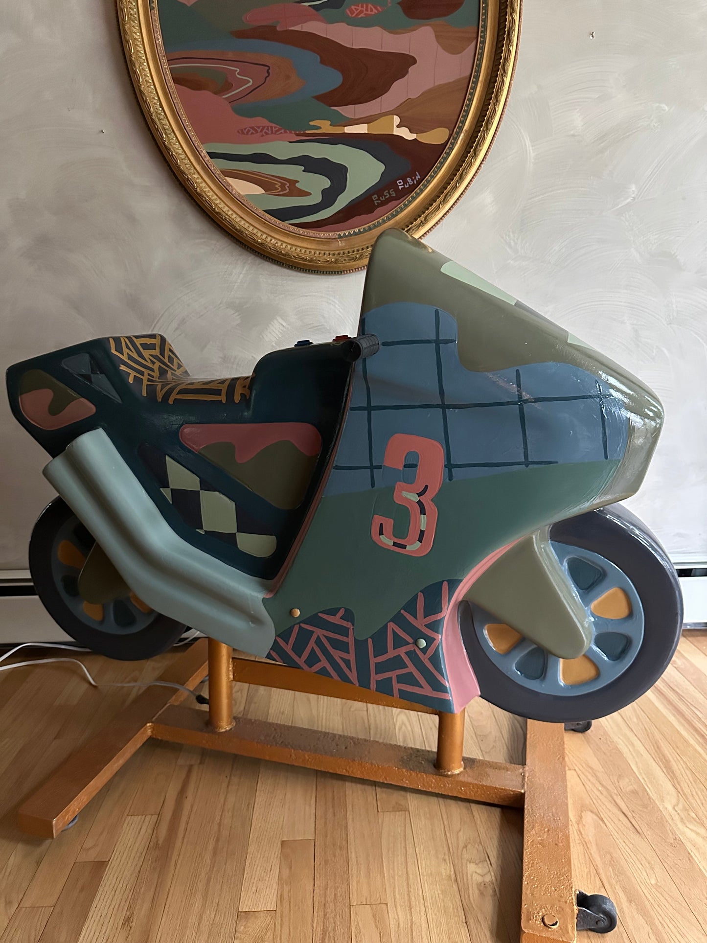 Hand painted motorcycle kiddie ride by Russ Rubin - side view
