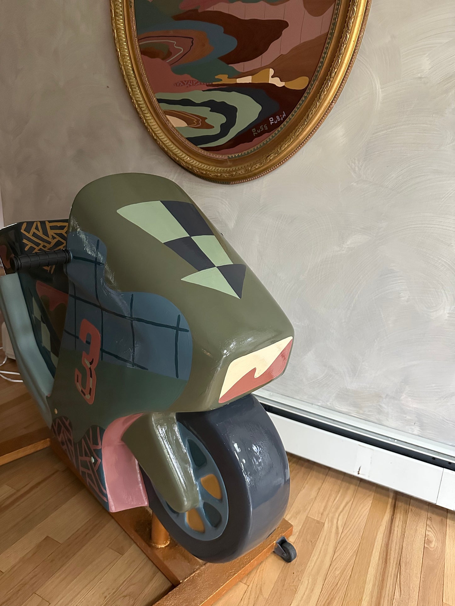 Hand painted motorcycle kiddie ride by Russ Rubin - front angle view