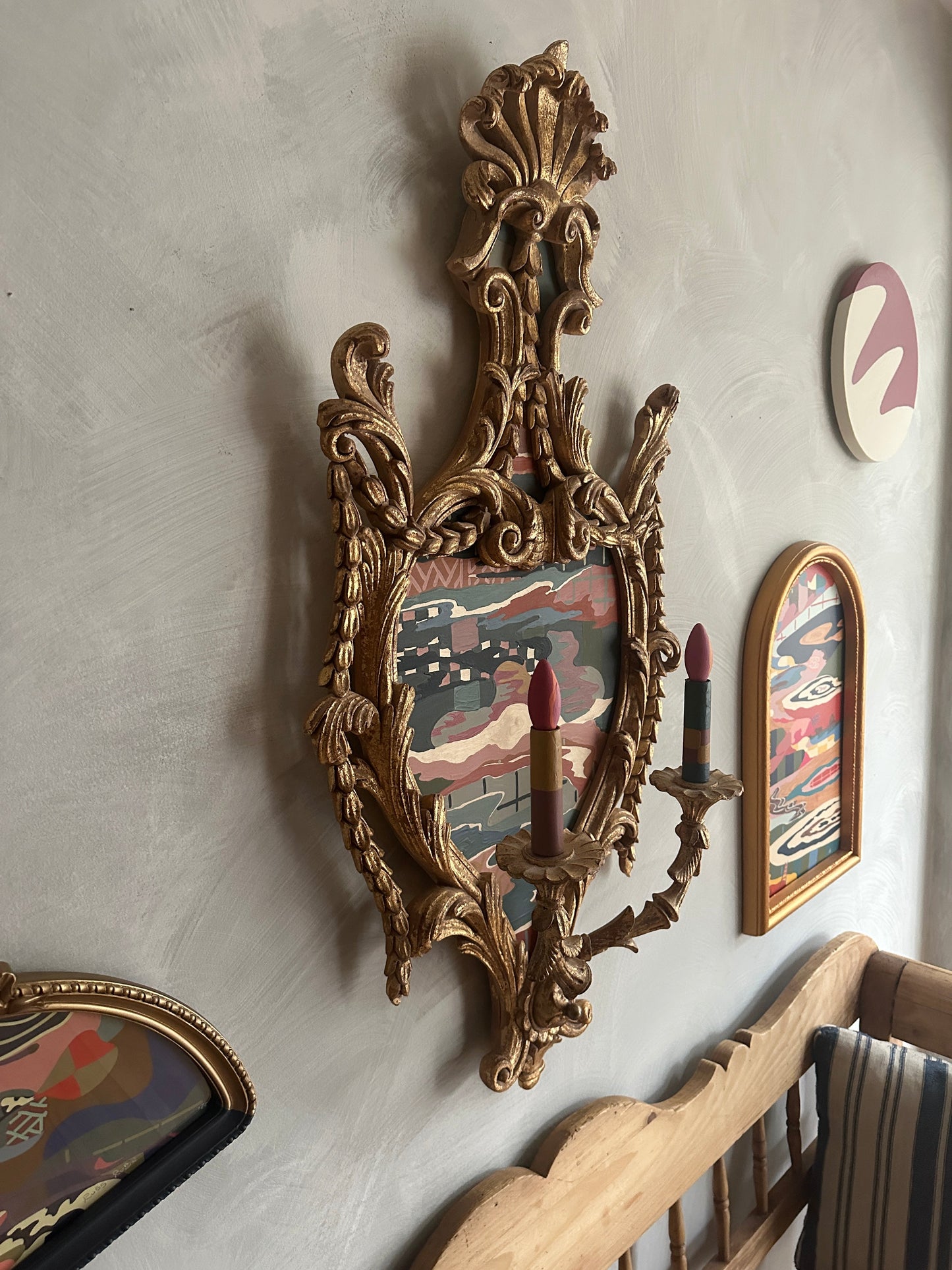 Abstract landscape painting on wood in vintage candelabra frame by Russ Rubin - angle view on wall with other art