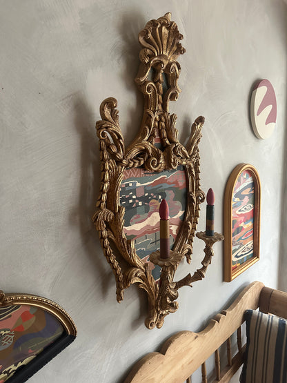 Abstract landscape painting on wood in vintage candelabra frame by Russ Rubin - angle view on wall with other art