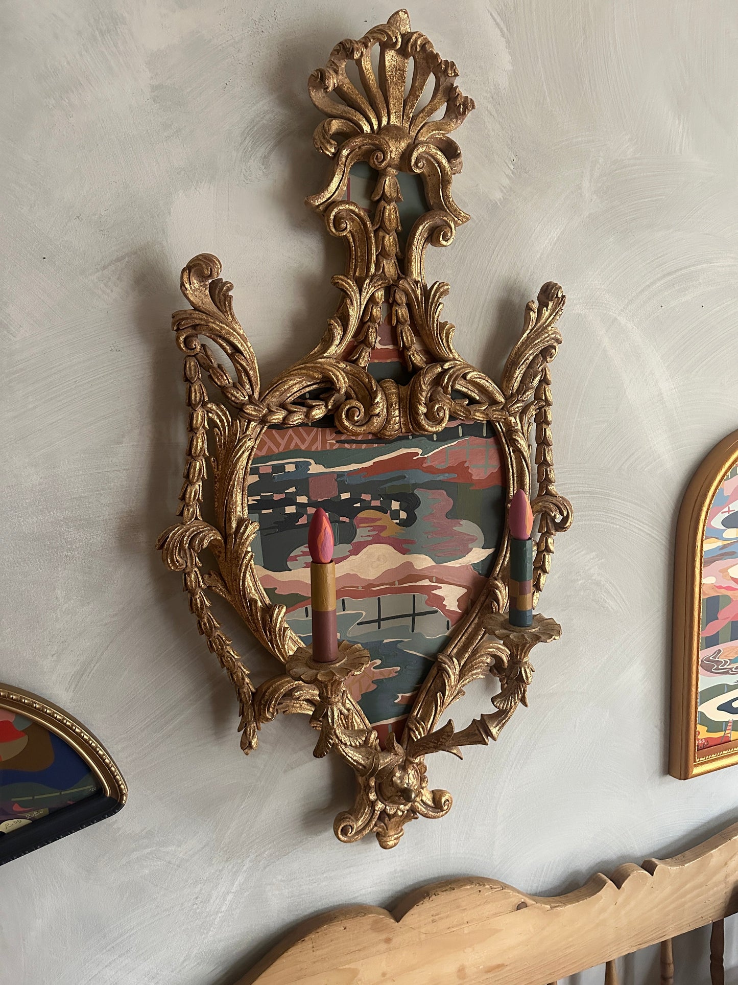 Abstract landscape painting on wood in vintage candelabra frame by Russ Rubin - angle view on wall with other art