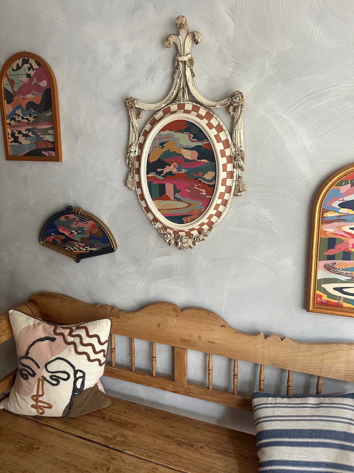 Abstract landscape painting on wood in vintage frame by Russ Rubin - angle view on wall with other art