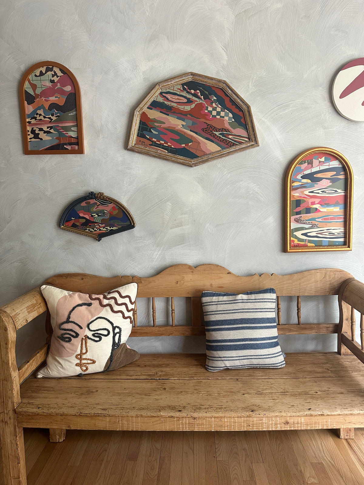 Abstract landscape painting on wood in vintage frame by Russ Rubin - front view on wall with other art