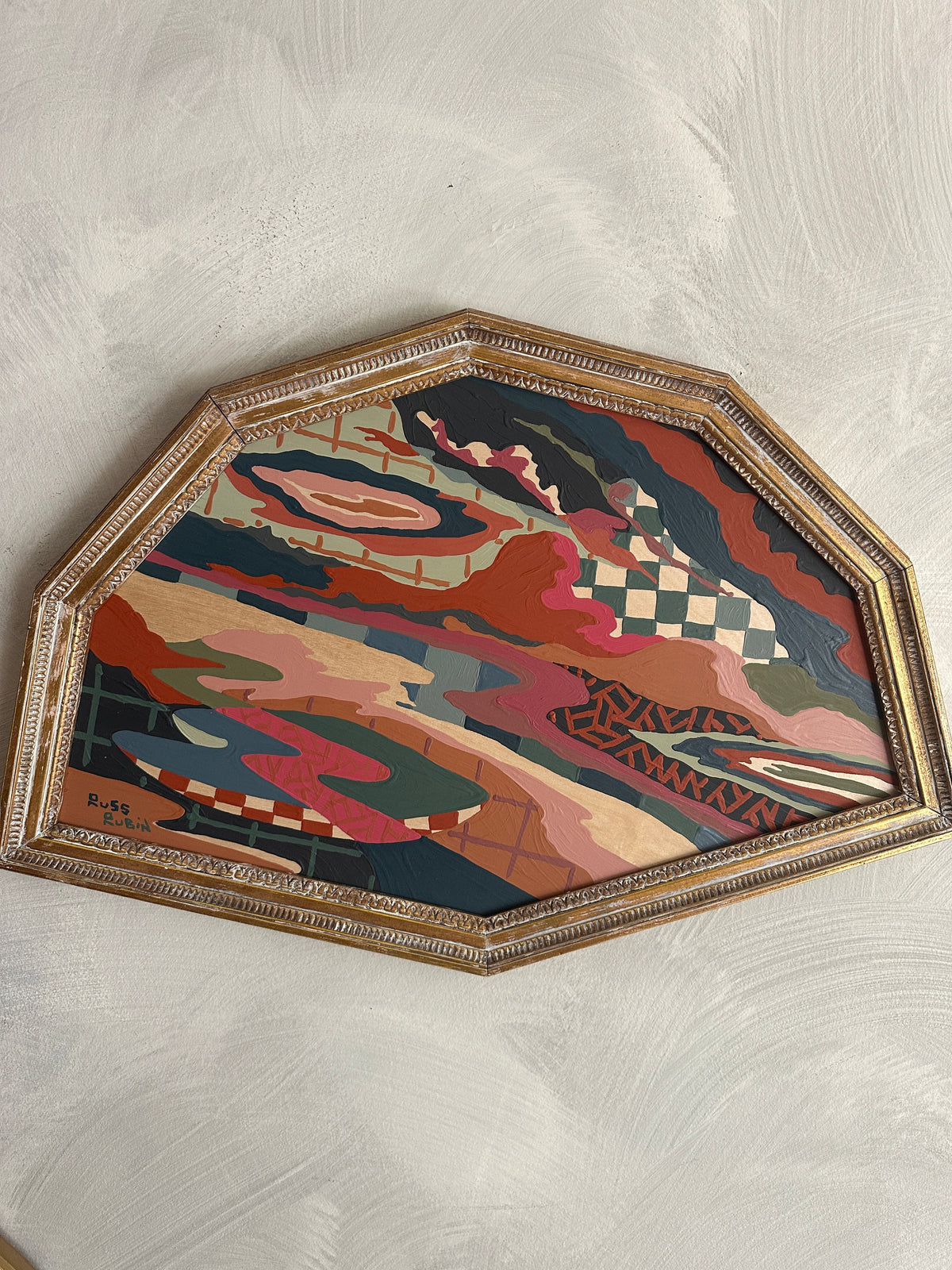 Abstract landscape painting on wood in vintage frame by Russ Rubin - front detail view on wall