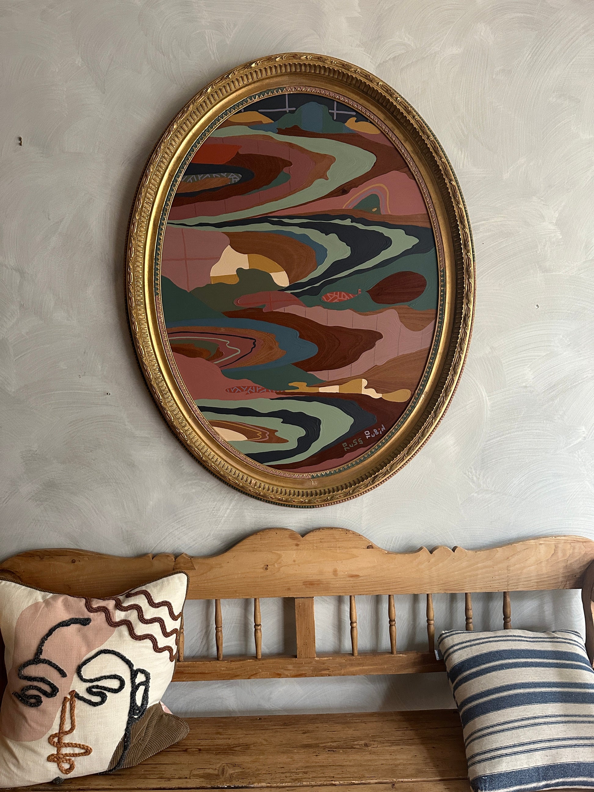 Abstract landscape painting on wood in vintage frame by Russ Rubin - front view on wall