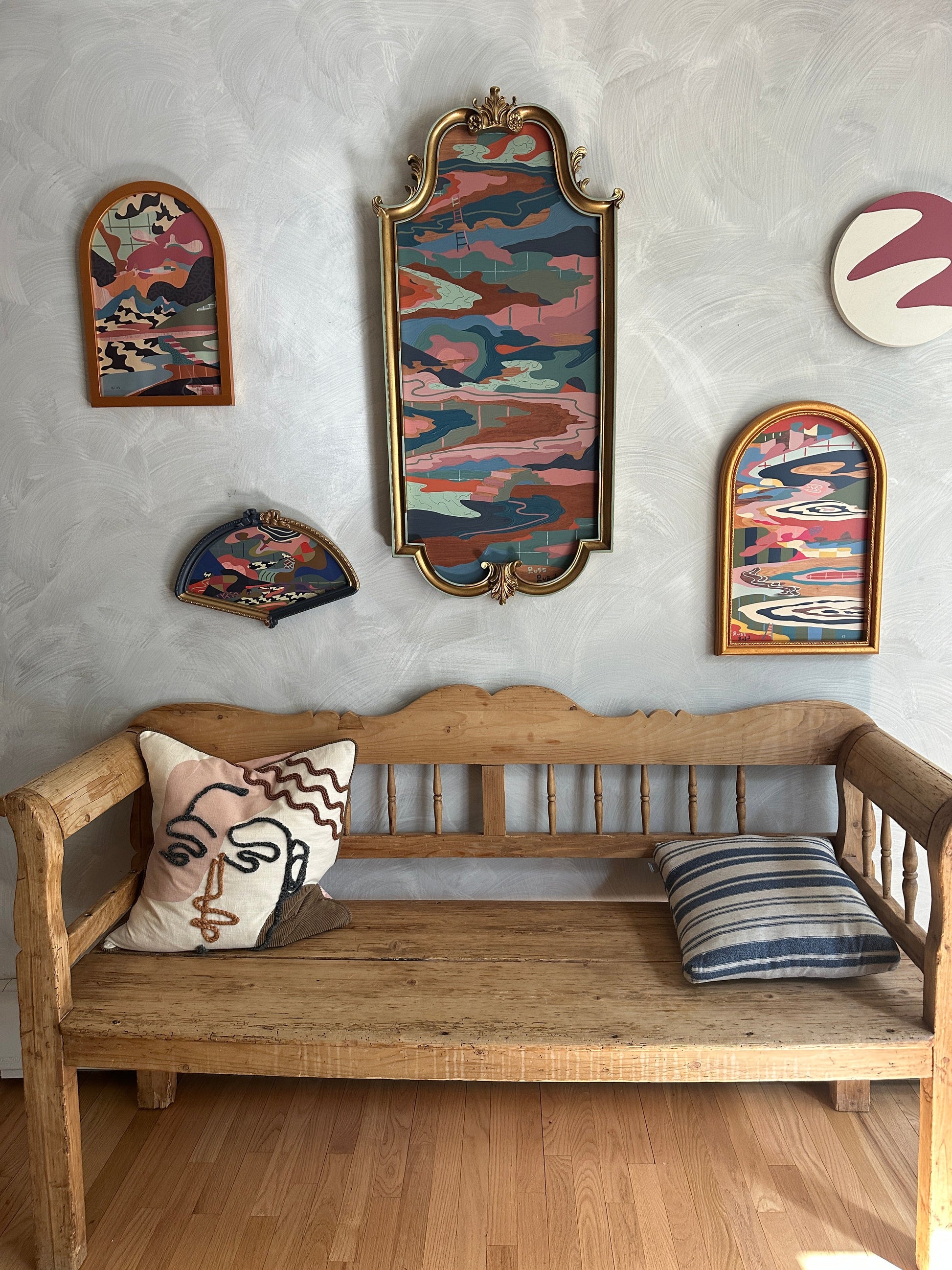 Abstract landscape on wood in vintage frame by Russ Rubin - front view on wall with other art