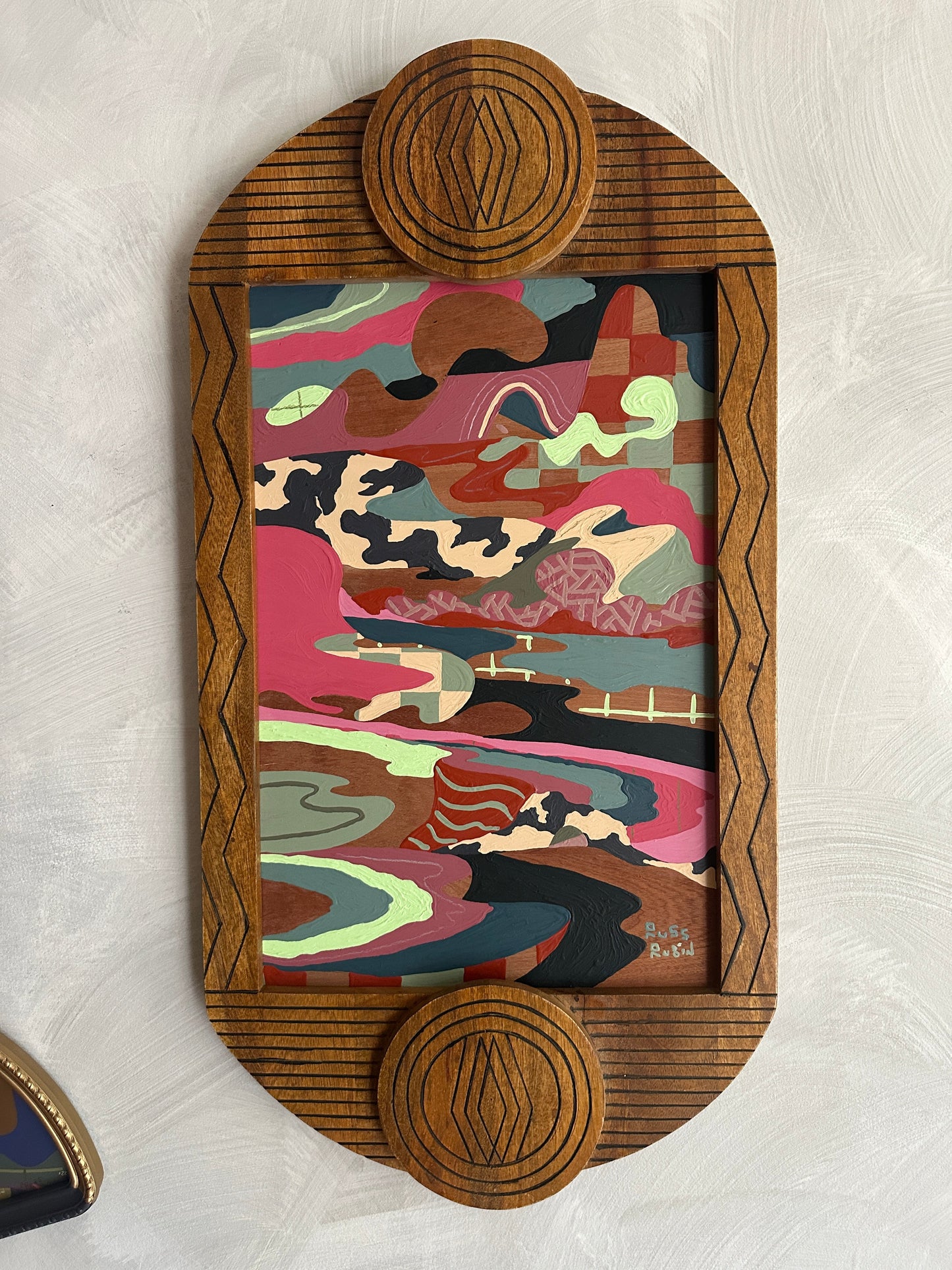 Abstract landscape painting on wood in vintage frame by Russ Rubin - front view on wall