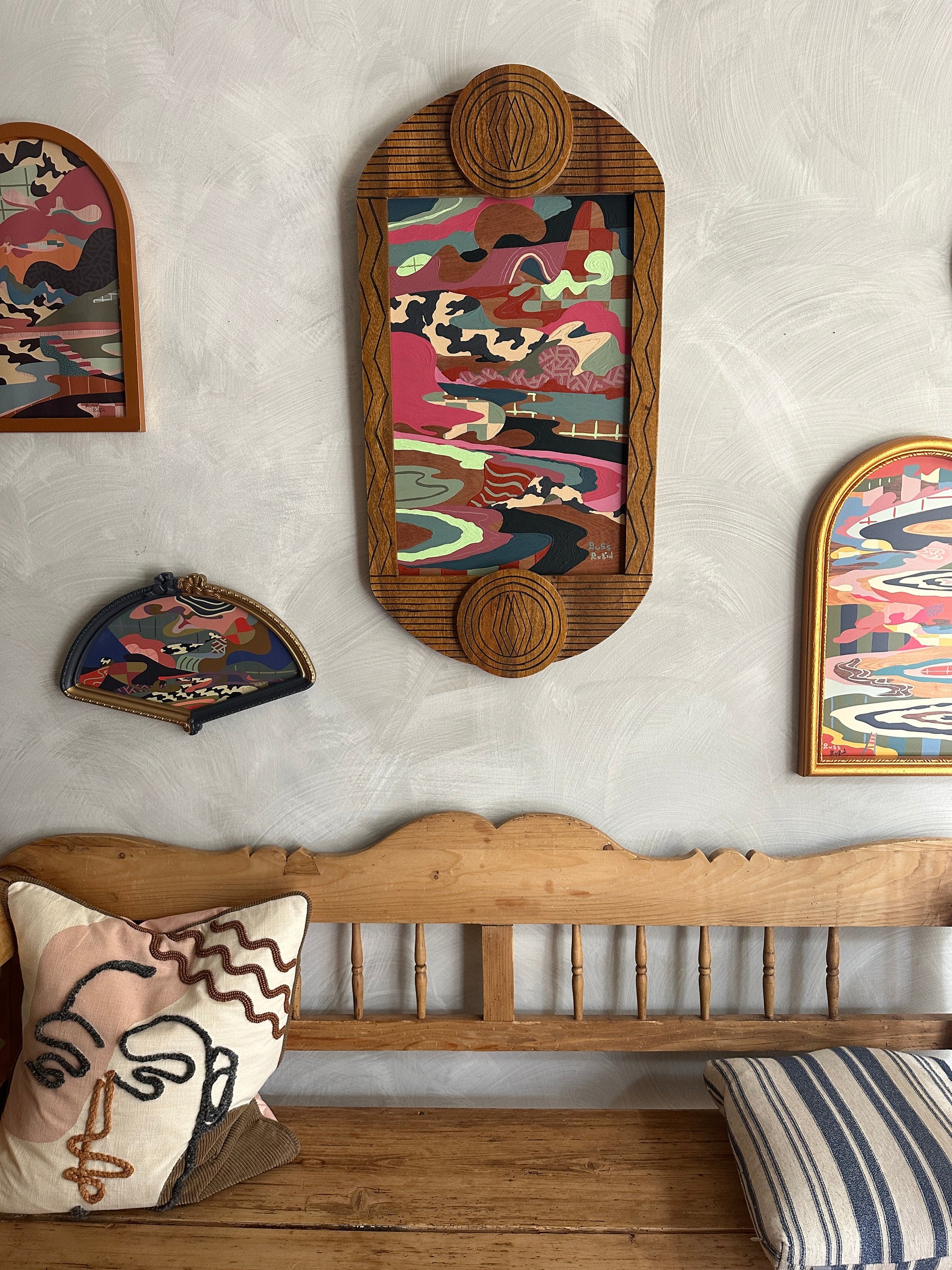 Abstract landscape painting on wood in vintage frame by Russ Rubin - front view on wall with other art