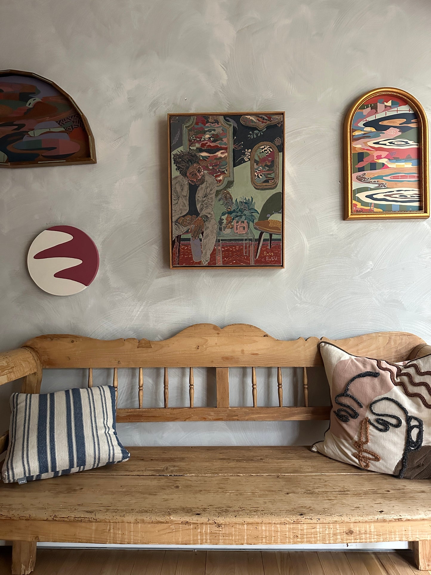 Self portrait on linen by Russ Rubin - front view on wall with other art