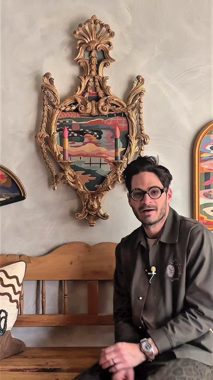 Russ Rubin discussing his abstract landscape painting on wood in vintage candelabra frame