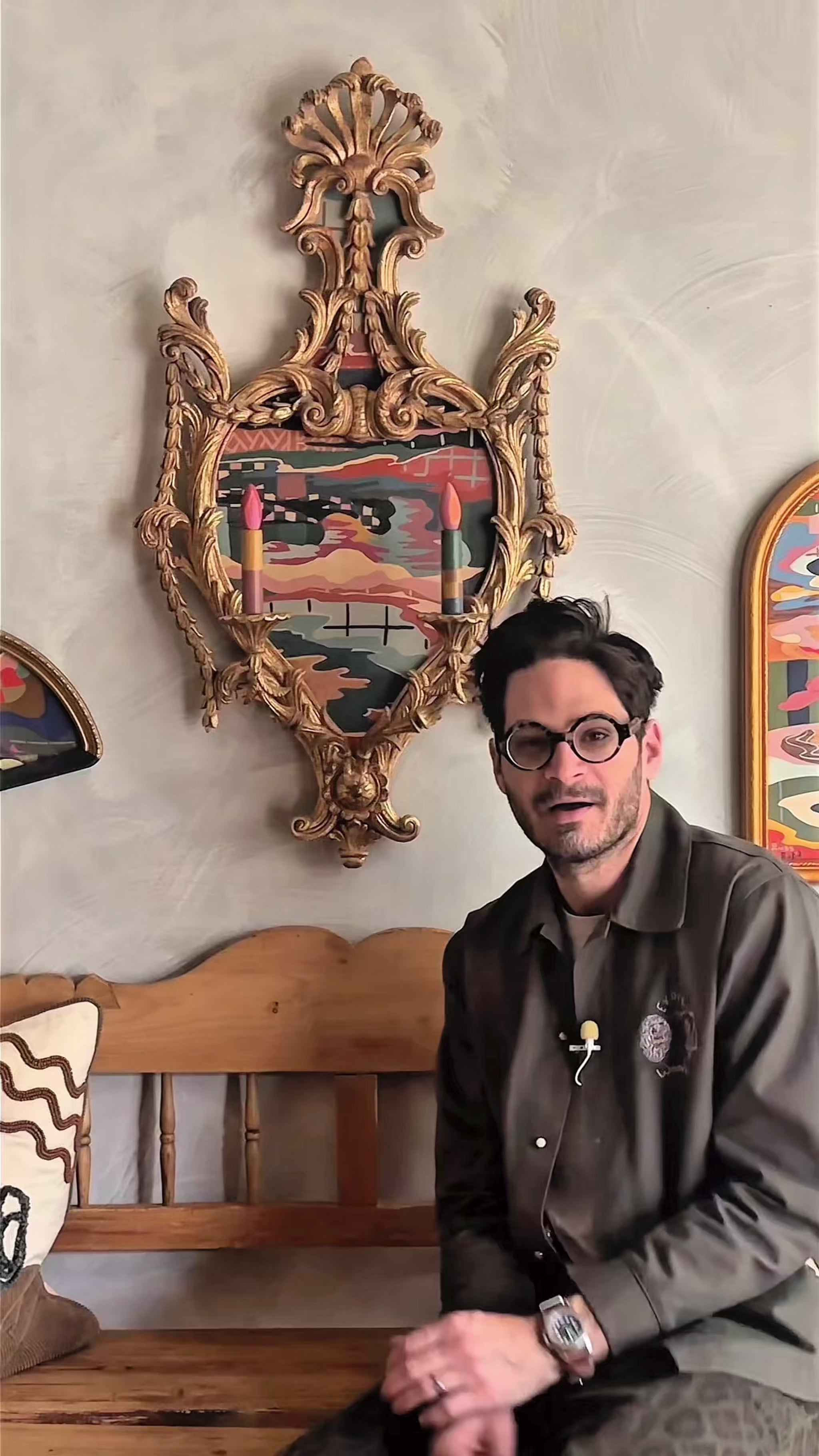 Russ Rubin discussing his abstract landscape painting on wood in vintage candelabra frame