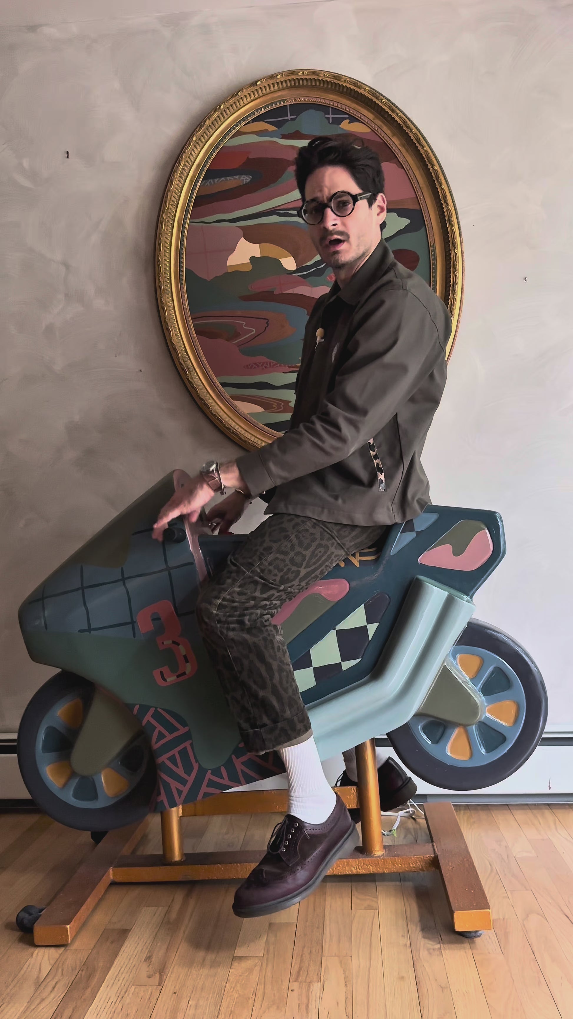 Russ Rubin discussing his hand painted motorcycle kiddie ride