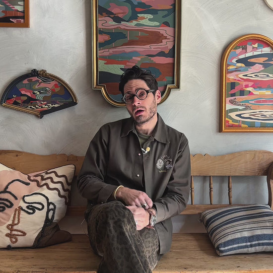 Russ Rubin discussing his abstract landscape on wood in vintage frame 