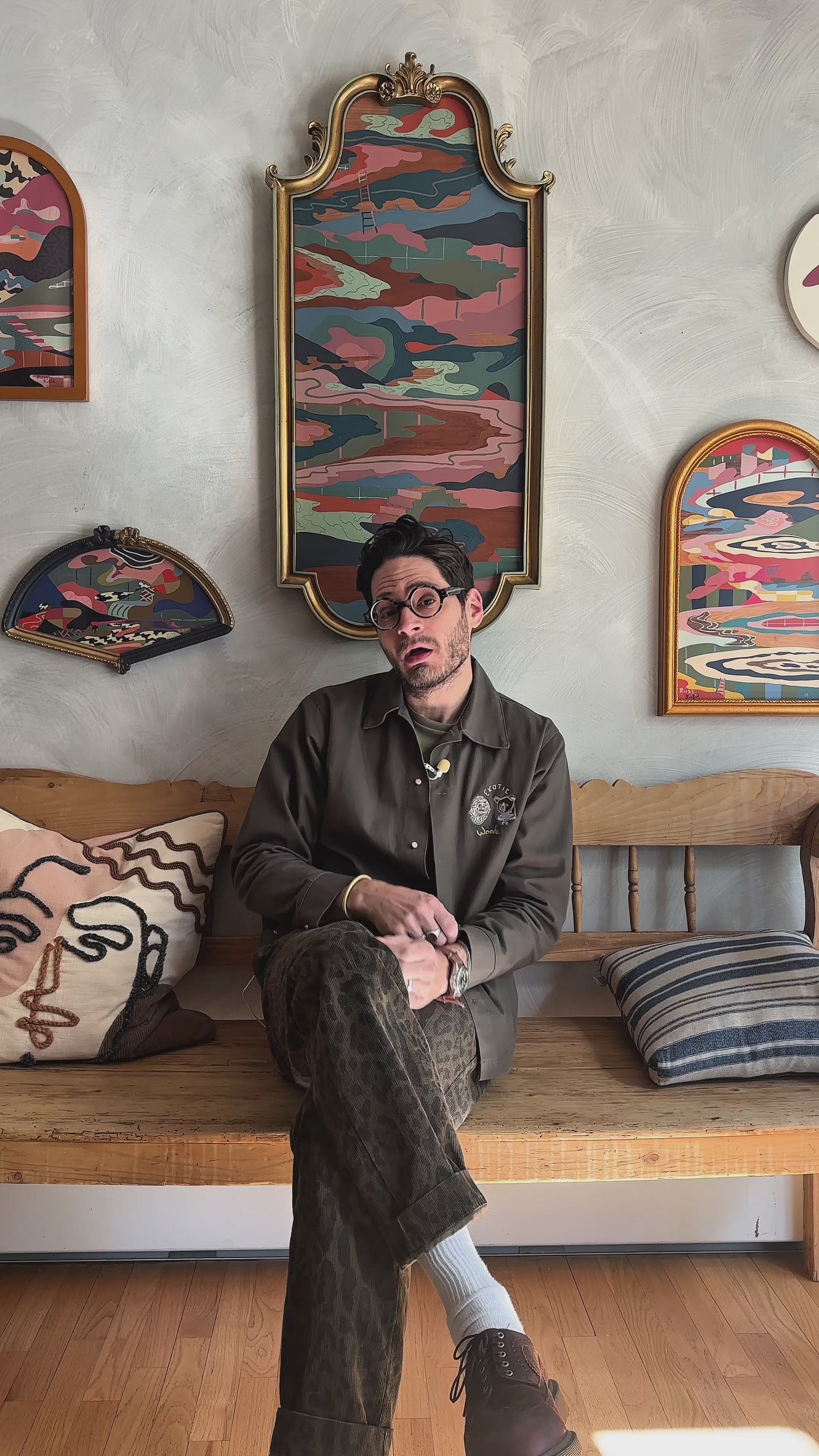 Russ Rubin discussing his abstract landscape on wood in vintage frame 