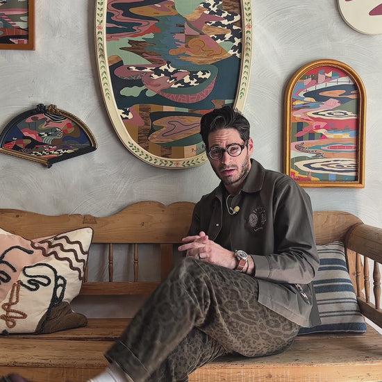 Russ discussing his abstract landscape on wood in vintage frame 