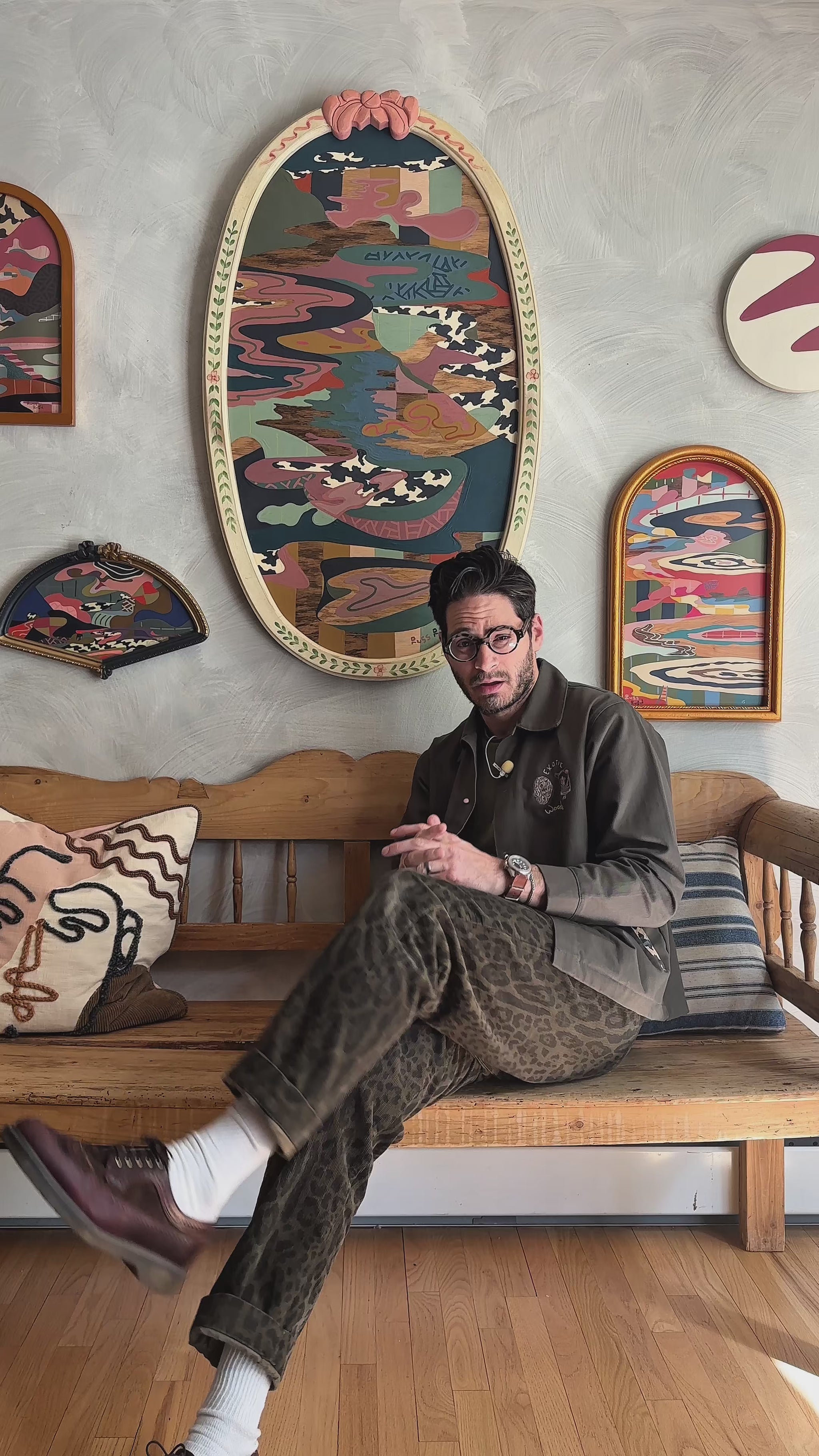 Russ discussing his abstract landscape on wood in vintage frame 